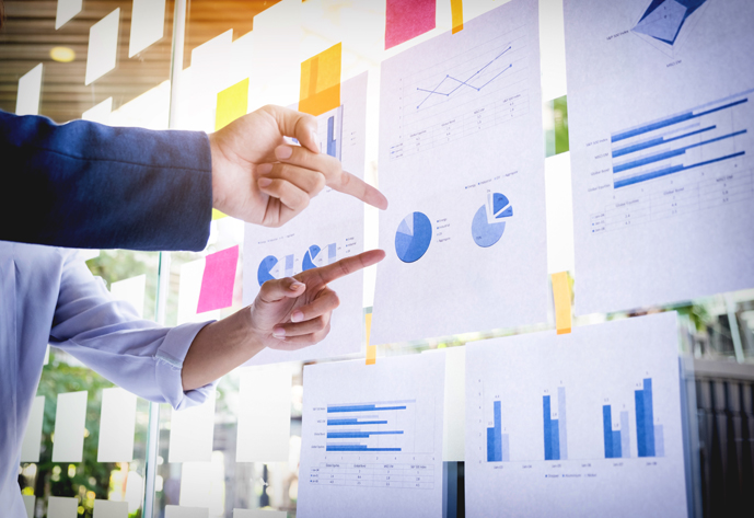 Businessman making presentation with his colleagues and business strategy digital layer effect at the office as concept.